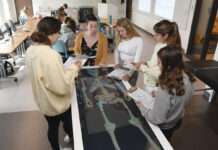 Some liberal arts schools adapting to major shifts AN INSIDE LOOK: Margaret Morrissey-Basler, assistant professor of health sciences, second from left, instructs students in an anatomy class at Providence College. Traditionally, liberal arts colleges are putting more emphasis on professional majors, such as the nursing program at PC, as interest has grown.
PBN PHOTO/MIKE SKORSKI