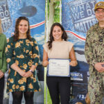 REWARDED: Kaylee Cabral, third from left, of the Naval Undersea Warfare Center Division Newport’s Combat Systems Department Cybersecurity Division, receives the 2023 Society of Women Engineers Helen Martha Sternberg Award from acting Technical Director Vicki Comeau, left; Emily Callahan, a representative of the New England Shoreline Section of the Society of Women Engineers; and Commanding Officer Capt. Chad Hennings during the annual awards ceremony on June 7.  COURTESY NAVAL UNDERSEA WARFARE  CENTER DIVISION NEWPORT 