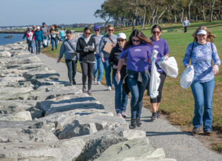 CLEAN SHORELINE: Volunteers and members of Save The Bay Inc. participate in a shoreline cleanup event at Colt State Park in Bristol. PBN PHOTO/MICHAEL SALERNO