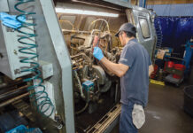 Groov-Pin regularly is purposeful toward its customers TUNING UP: Lang Yang, a davenport operator at Groov-Pin Corp., evaluates the inner workings of a machine at the Smithfield-based manufacturer.
PBN PHOTO/TRACY JENKINS