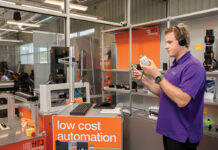 For igus, becoming carbon neutral means being opposite from everyone FINAL EXAM: Jan Hennecke, igus inc.’s product manager of low-cost innovation, tests out a product for quality at the East Providence facility.
PBN PHOTO/TRACY JENKINS