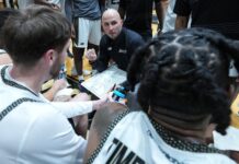 Bryant promotes Martelli Jr. to head men’s hoops coach PHIL MARTELLI JR., center, has been named Bryant University's new head men's basketball coach. He was an interim coach when Jared Grasso, who has since resigned, was suspended by the university back in late September. / COURTESY BRYANT UNIVERSITY