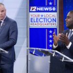 GABE AMO, right, Democratic congressional candidate, makes a statement while Republican congressional candidate Gerry W. Leonard Jr. looks on during Friday's debate at WPRI-TV CBS 12. / COURTESY JAMES BARTONE/WPRI-TV CBS 12
