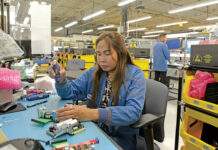 AstroNova is evolving to better face unpredictable futures HANDMADE: Assembly technician Romalyn Tuason works on an aerospace printer in AstroNova Inc.’s assembly room in West Warwick.
PBN PHOTO/ELIZABETH GRAHAM