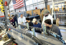 CCRI is building the future workforce and statewide economy MAKING THE CUT: Students at the Community College of Rhode Island’s Westerly Education Center work on splicing cables.
PBN PHOTO/ELIZABETH GRAHAM