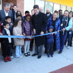 STATE AND LOCAL OFFICIALS and students at Frank D. Spaziano Elementary School in Providence cut the ribbon Friday on the new $44 million school building. / COURTESY PROVIDENCE PUBLIC SCHOOL DISTRICT
