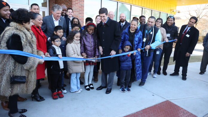 STATE AND LOCAL OFFICIALS and students at Frank D. Spaziano Elementary School in Providence cut the ribbon Friday on the new $44 million school building. / COURTESY PROVIDENCE PUBLIC SCHOOL DISTRICT
