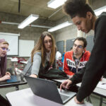 OFFERING GUIDANCE: Community College of Rhode Island professor Alyson Snowe, second from left, talks with her technical writing students, from left, Iskandar Miley, Kenneth Hanner and Bryan Pichardo. PBN PHOTO/RUPERT WHITELEY