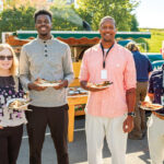 REWARDING MEAL:  Amica Mutual Insurance Co. employees, from left, Cindy Piatti, Isaiah Tamdji, Liddon Norman and Gil Petro eat during a National Customer Service Week company lunch event. COURTESY AMICA MUTUAL INSURANCE CO.