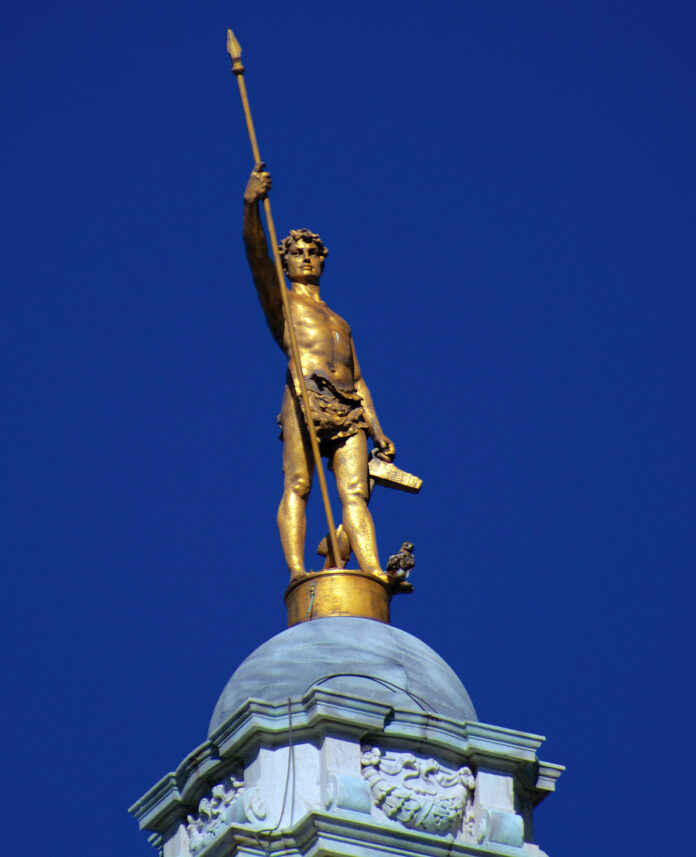 THE INDEPENDENT MAN statue that sits atop the Statehouse will now be on display in the building’s main entryway on the first floor through Jan. 8 before undergoing repairs and restoration, Gov. Daniel J. McKee says. / PBN FILE PHOTO/PAMELA BHATIA