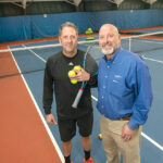 CELEBRATING 50 YEARS: Brothers Brian, left, and David Morin are the co-owners of Fore Court Racquet & Fitness Club, an indoor tennis, racquetball and fitness center in Cumberland started by their father, Maurice “Moe” Morin, in 1973. While tennis has remained a major focus, the brothers say business exploded after they introduced pickleball about a year ago. PBN PHOTO/MICHAEL SALERNO
