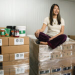 TAKING STOCK: Minnie Luong, co-founder and co-owner of Chi Foods LLC, at the company’s facility in Pawtucket. She says she didn’t seek a bank loan when starting her kimchi business because she knew small businesses are viewed as risky by lenders, especially minority- and women-owned businesses.  PBN PHOTO/RUPERT WHITELEY