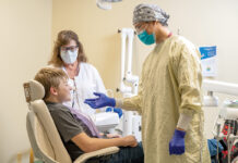 Trip to dentist on Block Island? Boat no longer needed OPEN UP: Dentist Milton J. Liu, right, and dental assistant Lori Beth Adler prepare to examine the teeth of patient Anthony Northup at Wood River Health in Hopkinton.
COURTESY WOOD RIVER HEALTH