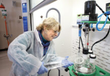 State, businesses investing in workforce training JOB TRAINING: Student Jenn Brown pours a solution into a jacketed reactor at the Westerly Education Center. The work is part of a course on process technology offered by the Community College of Rhode Island.
COURTESY COMMUNITY COLLEGE OF RHODE ISLAND