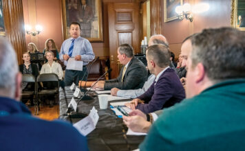 SPEAKS WITH AUTHORITY:  House Speaker K. Joseph Shekarchi talks before a joint legislative commission on plastic bottle waste before its meeting in December. Shekarchi has given caution signals about this year’s budget process because of a cloudy fiscal picture ahead.  PBN PHOTO/MICHAEL SALERNO