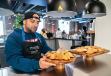 TEST RUN: Jorge Reyes of Providence displays pastries called pastelitos at the Culinary Hub of Providence – CHOP – a workforce training restaurant that’s due to open this spring in the Providence Public Library. Reyes is in the early stages of culinary ­training. PBN PHOTO/­MICHAEL SALERNO