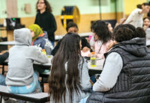 Governor’s plan to offer more free school meals is not enough, some say MEAL TIME: Students at Nathanael Greene Middle School in Providence eat lunch in the school’s cafeteria. Providence Public School District schools have offered breakfast and lunch at no charge since 2019 under the federal Community Eligibility Provision.
PBN PHOTO/MICHAEL SALERNO