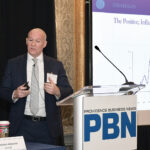ECONOMIC STIMULUS: Thomas Tzitzouris, head of fixed income research at Strategas Research Partners, tells attendees of Providence Business News’ Economic Trends Summit that the U.S. Treasury has been performing CPR lately – “consumer purchase resuscitation.”  PBN PHOTO/MIKE SKORSKI