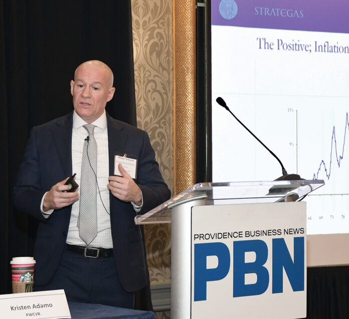 ECONOMIC STIMULUS: Thomas Tzitzouris, head of fixed income research at Strategas Research Partners, tells attendees of Providence Business News’ Economic Trends Summit that the U.S. Treasury has been performing CPR lately – “consumer purchase resuscitation.”  PBN PHOTO/MIKE SKORSKI
