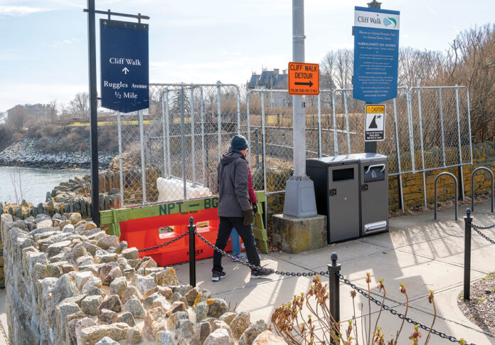 WALKERS HEADING south on the Newport Cliff Walk are stopped at Narragansett Avenue by fencing because part of the historic walk collapsed about two years ago. Visitors are required to detour through a nearby neighborhood to reconnect with the path farther south.  PBN FILE PHOTO/DAVID HANSEN