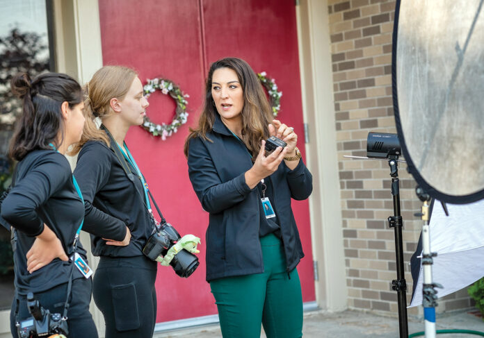 PICTURE ­PERFECT: Brandi Morgan Raupp, right, owner of East Coast Capture LLC, and her crew set up a photo shoot at a preschool in Cranston. From left are photographers Kayla Oliveira and Olivia Lace.  PBN FILE PHOTO/MICHAEL SALERNO