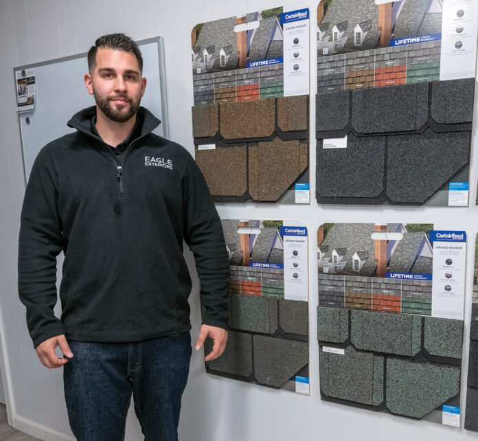 EXCEEDING EXPECTATIONS: David Lacreta is the owner of Eagle Exteriors Inc., a roofing and siding company in Cumberland that is booking jobs throughout Rhode Island and southern Massachusetts.
PBN PHOTO/MICHAEL SALERNO EXCEEDING EXPECTATIONS: David Lacreta is the owner of Eagle Exteriors Inc., a roofing and siding company in Cumberland that is booking jobs throughout Rhode Island and southern Massachusetts.
PBN PHOTO/MICHAEL SALERNO