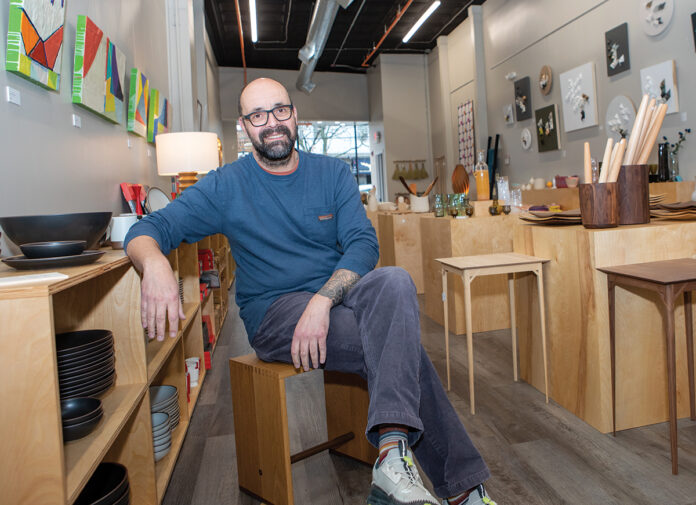 AFFORDABLE ALTERNATIVE: Torsten Mayer-Rothbarth and his wife, Megan, opened Inhabit, a furniture, home goods and art store in Warren, after finding it too expensive to travel to regional art shows.  PBN PHOTO/KATE WHITNEY LUCEY