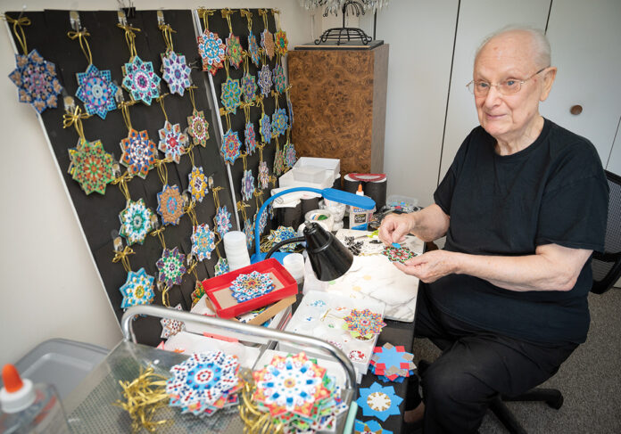 NO QUIT: Veteran Raymond Sienko makes Christmas ornaments in his Newport home in hopes of making it into a side venture with the help of the Veterans Affairs Providence Health Care Employment Resource Center. Only a small number of veterans who get assistance from the center seek to start a small business.  PBN PHOTO/DAVID HANSEN
