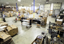 EMPLOYEES STOCK the warehouse of Warwick-based health care equipment distributor CME Corp. The John H. Chafee Center for International Business' annual World Trade Day on Wednesday will focus on supply chain resiliency and being prepared for the next crisis that may cause disruptions within supply chains both locally and globally. / COURTESY CME CORP.