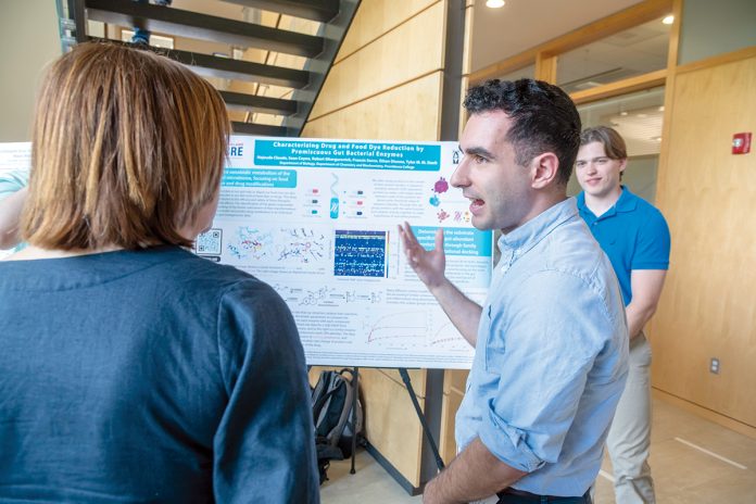 FROM THE GUT: University of Rhode Island student Sean Coyne, a researcher in the Rhode Island IDeA Network of Biomedical Research Excellence program, describes his team’s research on gut bacterial enzymes.
COURTESY UNIVERSITY OF RHODE ISLAND/MICHAEL SALERNO FROM THE GUT: University of Rhode Island student Sean Coyne, a researcher in the Rhode Island IDeA Network of Biomedical Research Excellence program, describes his team’s research on gut bacterial enzymes.
COURTESY UNIVERSITY OF RHODE ISLAND/MICHAEL SALERNO
