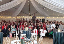 Falvey Insurance Group CELEBRATING THE HOLIDAYS: Falvey Insurance Group employees gather for a company holiday party.
COURTESY FALVEY INSURANCE GROUP