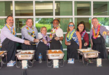 Amica Mutual Insurance Co. LUNCHTIME: Members of Amica Mutual Insurance Co.’s senior leadership team serve lunch to employees at one of the company’s summer cookouts.
COURTESY AMICA MUTUAL INSURANCE CO.