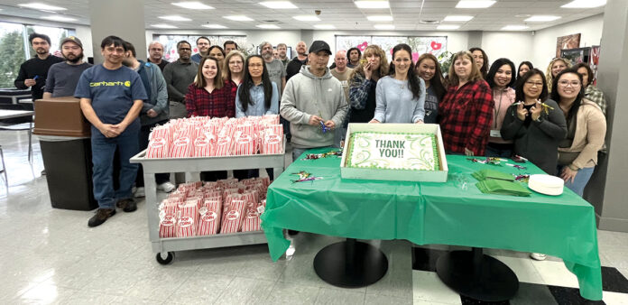 SNACK TIME: Swarovski Optik North America Ltd. employees gather for cake and popcorn.
COURTESY SWAROVSKI OPTIK NORTH AMERICA LTD. SNACK TIME: Swarovski Optik North America Ltd. employees gather for cake and popcorn.
COURTESY SWAROVSKI OPTIK NORTH AMERICA LTD.