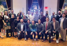 PARTY PEOPLE: DarrowEverett LLP employees gather during the company’s holiday party.  COURTESY DARROWEVERETT LLP