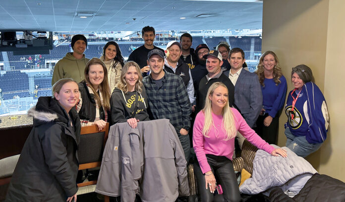 GAME ON: Employees for JPS Construction & Design Inc. take in a Providence Bruins game at the Amica Mutual Pavilion in Providence.  COURTESY JPS CONSTRUCTION & DESIGN INC.