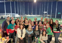 HOLE IN ONE: South County Smiles employees gather for a holiday party at Topgolf Rhode Island in Cranston.  COURTESY SOUTH COUNTY SMILES
