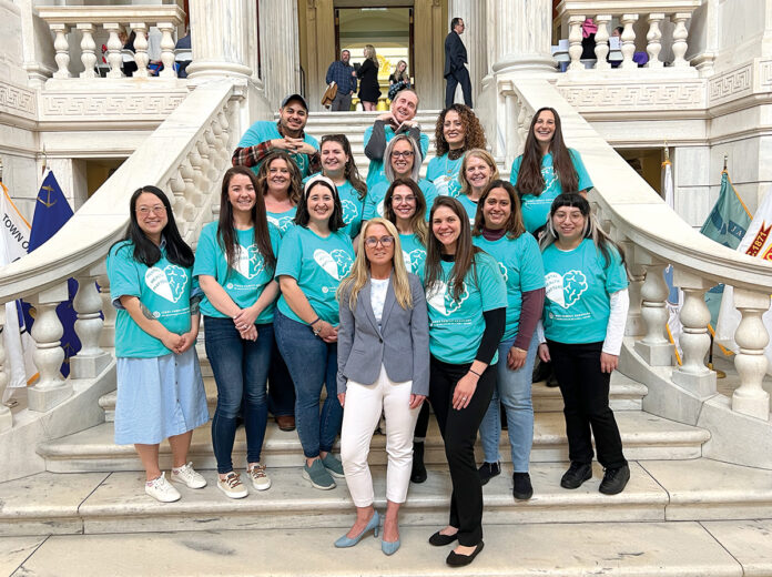STATE LEVEL: Tides Family Services staff members gather at the R.I. ­Statehouse.  COURTESY TIDES FAMILY SERVICES