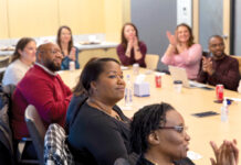 MEET UP: Staffers at Vanasse Hangen Brustlin Inc. attend a company meeting at the firm’s office.  COURTESY VANASSE HANGEN BRUSTLIN INC.