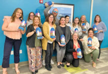 Westerly Community Credit Union PAINT JOB: Employees for Westerly Community Credit Union hold up paintings they made during a recent company Paint Night.
COURTESY WESTERLY COMMUNITY CREDIT UNION