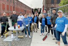 Coastal1 Credit Union PAWTUCKET PROUD: Coastal1 Credit Union employees help clean up around the Boys & Girls Club of Pawtucket.
COURTESY COASTAL1 CREDIT UNION