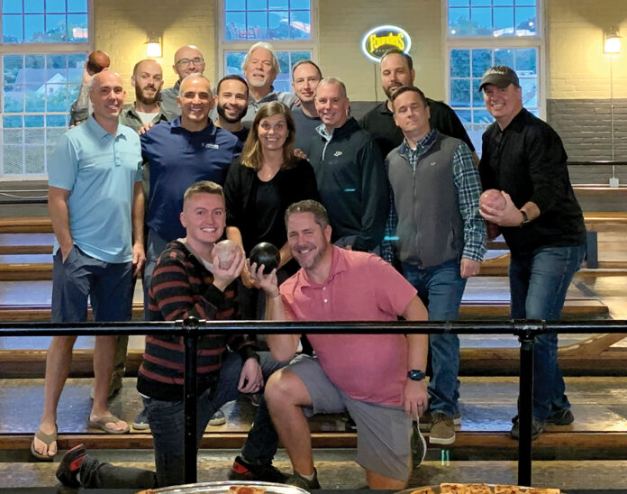 GONE BOWLING: Compass IT Compliance LLC employees gather for a night of bowling at Breaktime Bowl and Bar in Pawtucket.
COURTESY COMPASS IT COMPLIANCE LLC GONE BOWLING: Compass IT Compliance LLC employees gather for a night of bowling at Breaktime Bowl and Bar in Pawtucket.
COURTESY COMPASS IT COMPLIANCE LLC