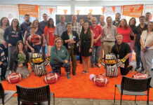 Embrace Home Loans Inc. GAME TIME: Employees at Embrace Home Loans Inc. hold a football tailgate party at the office.
COURTESY EMBRACE HOME LOANS INC.