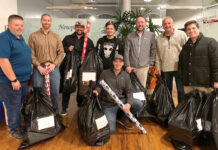 Envision Technology Advisors LLC ALL WRAPPED UP: Envision Technology Advisors LLC employees take part in charity gift wrapping for the 2023 holiday season.
COURTESY ENVISION TECHNOLOGY ADVISORS LLC