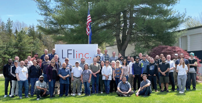 PAY BUMP: LFI Inc. employees celebrate a 5% pay ­increase.  COURTESY LFI INC.