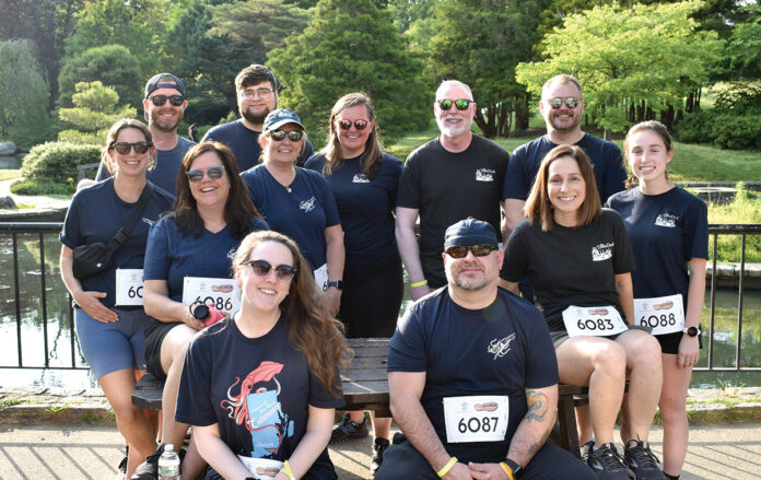 FAST TRACK: The Town Dock employees compete in a recent local road race.  COURTESY THE TOWN DOCK