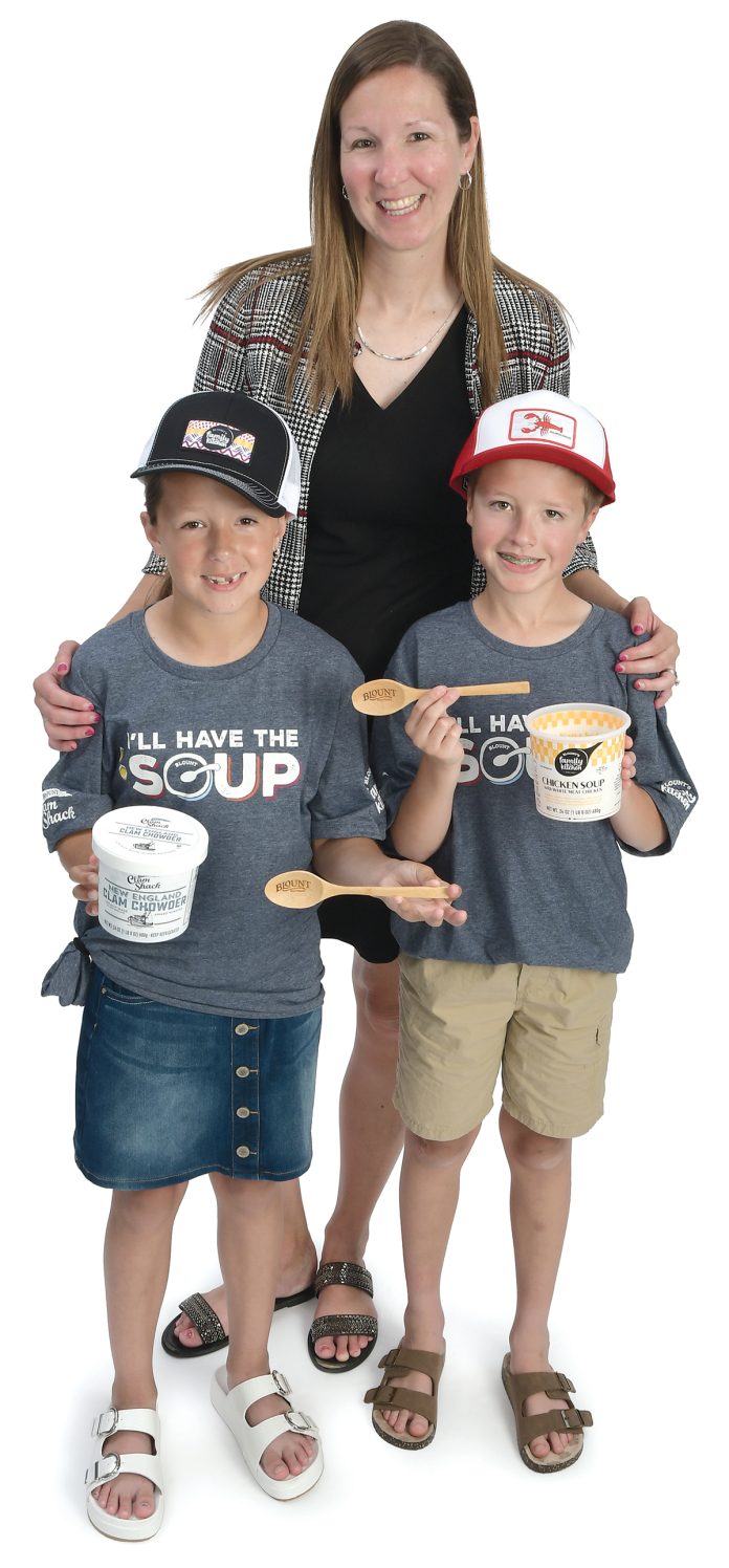 the prop  Valerie Ball poses with her two children, Connor, 10, and Natalie, 8, and holds various Blount Fine Foods products.