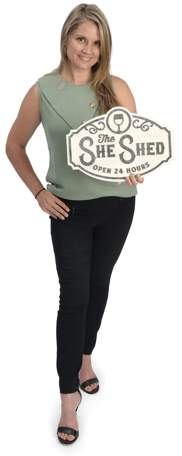 the prop  Melissa Bouchard holds a sign from her office with the phrase “The She-Shed.” “The prop is a fun reminder of how far Fusion3 has come since we first started in 2019 … and who doesn’t want a she-shed?” Bouchard said.