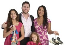 the prop  Gian Gentile poses with his wife, Ines; his two daughters, Gabriella and Cali; his triathlon medals; and racing sneakers.