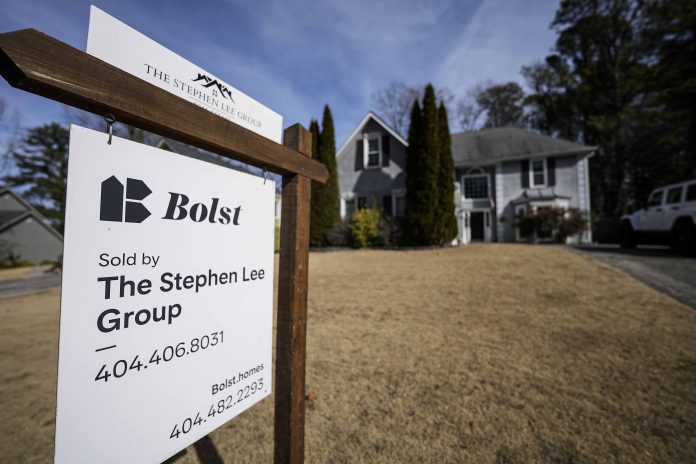 THE MEDIAN PRICE for a single-family home sold in Bristol County, Mass., in June was $510,000, The Warren Group said on Tuesday. /AP FILE PHOTO / MIKE STEWART