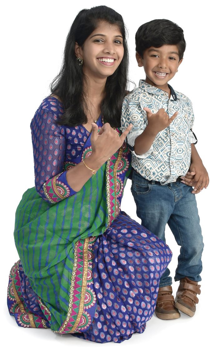         the prop            Sarnya Kunchithapatham Pichaiyappa                wears a traditional Indian saree, which reminds her of her identity and roots, and poses with her son, Dharma, 3.